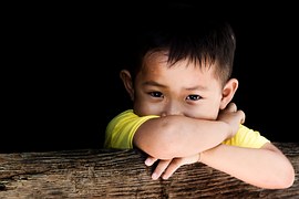 child, young sibling, hands crossed, brown hair