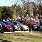 justice walk_People_park_cars_tents_balloons