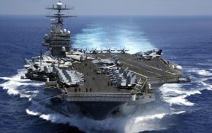 aircraft carrier, floating, loaded, airplanes on it, in water, moving, in ocean